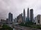 A view of the Kuala Lumpur skyline with cloudy weather