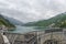 The view of Kurobe Dam. The Kurobe Dam or Kuroyon Dam is a variable-radius arch dam on the Kurobe River in Toyama Prefecture