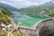 The view of Kurobe Dam. The Kurobe Dam or Kuroyon Dam is a variable-radius arch dam on the Kurobe River in Toyama Prefecture