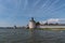 View of the Kuznechnay Blacksmith Tower of the Kirillo-Belozersky Monastery and public beach in Kirillov town, Vologda region.