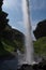 View of Kvernufoss from behind the waterfall, Iceland