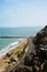 view of La Rosa Nautica by the sea in Makaha Beach.Route costa verde, Group of surfers learning to surf in a bright summer