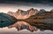 View of Lac Long with massif Des Cerces reflection on the lake in Claree valley at France