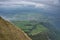 View of Lae Lucerne and lush green meadows of Switzerland  from the top of Mt. Rigi on a overcast and windy day in Switzerland