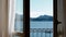 View of Lago Maggiore through closing window.