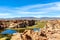 View of the Laguna Negra, Black lagoon Lake wedged between rock formations in Altiplano, Bolivia