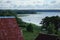 A view of the lake and a boat sailing along it with fishermen