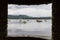 View of lake and boats via window in Lake Windermere