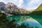 View of Lake Braies under a blue sky with white clouds