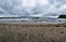 View of the lake with cumulonimbus clouds above it, fisheye