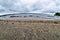 View of the lake with cumulonimbus clouds above it, fisheye