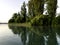 View of the lake at dawn early in the morning, silhouettes of hil