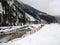 View of a lake flowing through the frozen valley