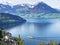 View of Lake Lucerne or Vierwaldstaetersee with Vitznau settlement and Swiss Alps in the background