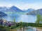 View of Lake Lucerne or Vierwaldstaetersee with Vitznau settlement and Swiss Alps in the background