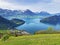 View of Lake Lucerne or Vierwaldstaetersee with Vitznau settlement and Swiss Alps in the background