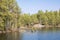 View of Lake Meiko area in spring, rocks, pine trees and lake, Kirkkonummi, Finland