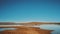 View of The Lake of Merzouga Morocco, birds on dry lake and wild camels walk on horizon. Lake in the Morocco Desert, 4k