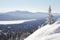 View of lake with mountain range Zyuratkul, winter landscape. Sn