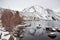 View of Lake on the Mountains in Winter Fog with Dramatic Snow Capped Mountains in the Background