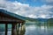 View of the lake near St. Wolfgang with a wooden pier and Alps m