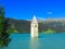 View of the lake Resia. perfect blue sky over the azure water in lake. Bell tower of the Reschensee South Tyrol, Italy