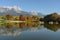 View of Lake Ritzensee on a sunny autumn day in Saalfelden with reflection of the Steinernes Meer. Saalfelden, Pinzgau, Salzburg