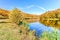 View of the lake in Satanovo, Khmelnitsky region, Ukraine. Fragment of the national nature park Podolsky Tovtry in autumn colors.