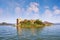 View of Lake Skadar and the ruined fortress of Grmozur on a small island. Montenegro