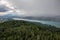 View from Lake WÃ¶rther See in the Austrian Alps overlooking a beginning storm with dark clouds and rain