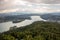 View from Lake WÃ¶rther See in the Austrian Alps overlooking a beginning storm with dark clouds and rain