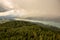 View from Lake WÃ¶rther See in the Austrian Alps overlooking a beginning storm with dark clouds and rain