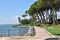 View of the lakefront by day with pedestrian street and sea