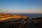 View of Lampedusa coast at sunset in the summer season