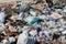 A view of the landfill. Garbage dump. A pile of plastic rubbish, food waste and other rubbish. Pollution concept. A sea of garbage