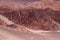 View of the landscape of the Atacama Desert. The rocks of the Mars Valley Valle de Marte and Cordillera de la Sal, Atacama