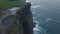 View landscape cliffs of moher capturing video of a drone from the air in amazing evening day.