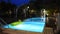 View landscape garden and lawn with swimming pools of resort in night time