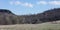 View of the landscape with a hunting tower on the edge of the forest and field