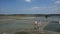 View landscape of salt farming and wind turbine with clouds sky at outdoor