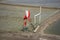 View landscape of salt farming and wind turbine with clouds sky at outdoor