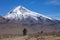 View of the Lanin Volcano from the road to Tromen Lake in Neuquen, Argentina. This volcano is covered by eternal snow