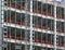 View of a large building development under construction with steel framework and girders supporting the metal floors with safety f