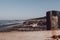 View of a large group of seals basking in the sun by the water on Horsey beach, Norfolk, UK