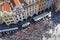 View of Large group of tourists at Prague Old Town square looking up to Old Town Hall tower.