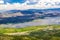 View Of Large Valley With Lake And Road