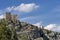 View of Laudegg Castle, overlooking a slate ledge, Ladis, Serfaus, Austria, against a beautiful sky