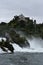 View of Laufen castle towering over Rheinfall in Switzerland