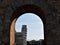 View of the Leaning Tower of Pisa through Arch