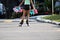 View of the legs of a girl carrying she toys, while is skating.